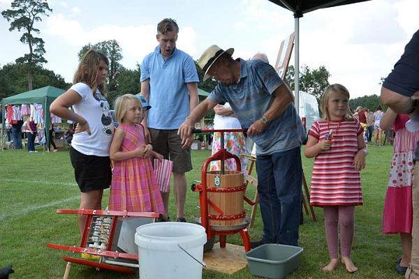 32. Demonstrating the village apple press.jpg